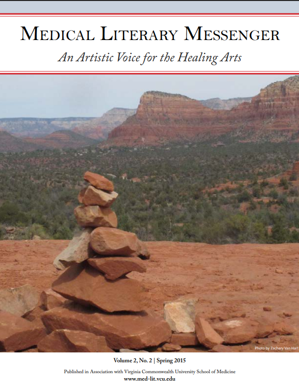 Photo of a stack of balanced red rocks with a landscape of trees and rock formations visible in the distance, the MLM banner is over the top of the photo